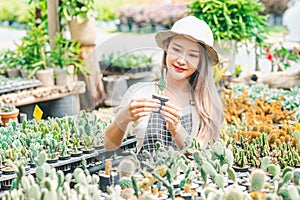 Young women doing hobbies taking care of plants, watering, shoveling flowers. In the garden during the break from work