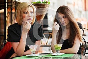 Young woman eating an ice cream