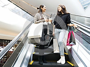 Young women enjoy shopping together in the weekend