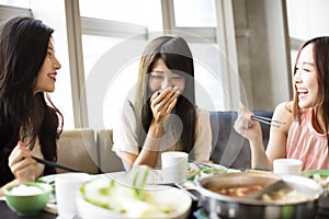 Young Women group Eating hot pot