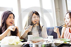 Young Women group Eating hot pot