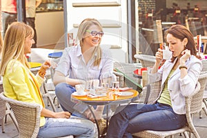 Young Women have Coffee Break Together