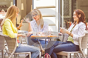 Young Women have Coffee Break Together