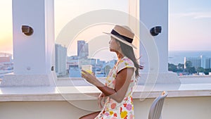 young women having a drink on a rooftop bar