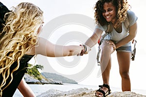 Young women helping each other photo