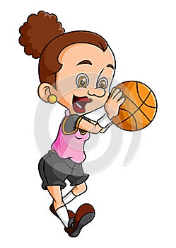 The young women is holding and dribbling the basketball