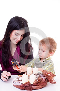 Young women with a little boy made advent wreath