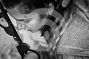 Young women locked with handcuffs to radiator