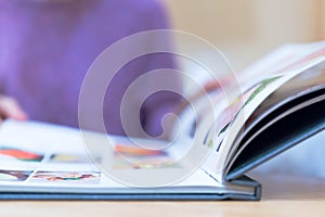 Young women looking menu at restaurant, selective focus on menu