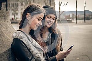 Young women looking at a mobile phone
