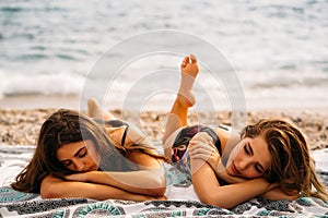Young women lying on beach