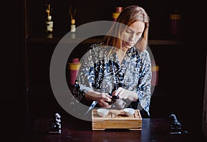Young women making and drink chinese tea ceremony