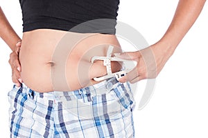 Young Women Measuring Fat Belly With Fat Caliper