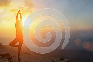 Young women meditate while doing yoga meditation, spiritual mental health practice with silhouette of lotus pose having peaceful