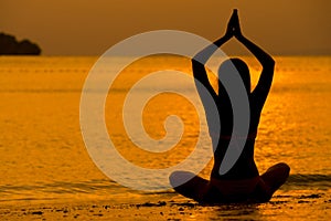 Young women meditate while doing yoga meditation, spiritual mental health practice with silhouette of lotus pose having peaceful
