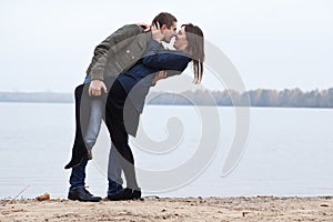 Young women and men flirt at lake