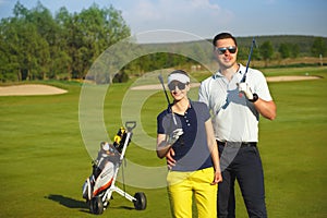 Young women and men playing golf