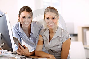 Young women at office working with tablet