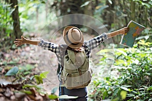 young women people Hiking with friends backpacks walking together and looking map and taking photo camera by the road and looking