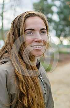 Young women poses outdoors