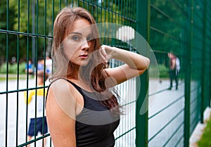 Young women posing near the sports ground