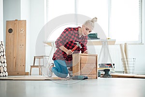 Young women repairing furniture at home