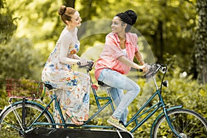 Young women riding on bicycle