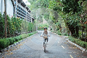 Young women riding folding bikes on the road