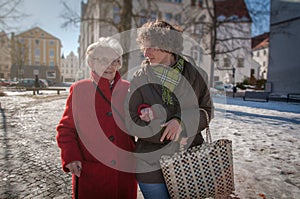 Young woman going for shopping with senior woman