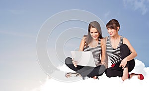 Young women sitting on cloud with copy space