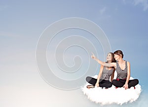 Young women sitting on cloud with copy space
