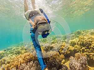 Young women at snorkeling in the tropical water