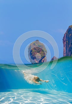 Young women at snorkeling in the tropical water