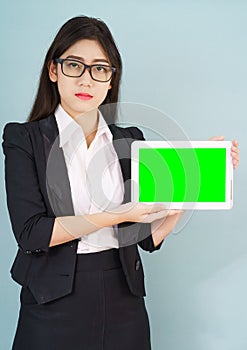 Young women in suit holding her digital tablet mock up