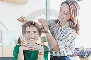 young women trying on handmade headband