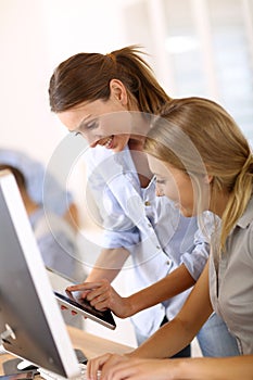 Young women using tablet at office