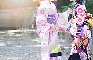 Young women wearing traditional Japanese Kimono at Kyoto, Japan