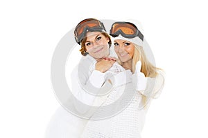 Young women in winter warm clothes and ski glasses.