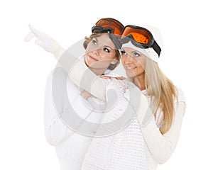 Young women in winter warm clothes and ski glasses.