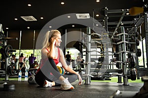 Young women work out at the gym to strengthen the body