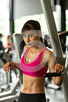 Young women work out at the gym to strengthen the body