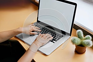 Young women working on her laptop with blank copy space screen for your advertising text message in office