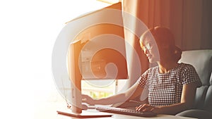 Young women working at home with her computer