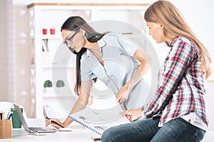 Young women working in office