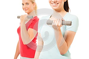 Young women working out with dumbbells