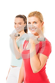 Young women working out with dumbbells