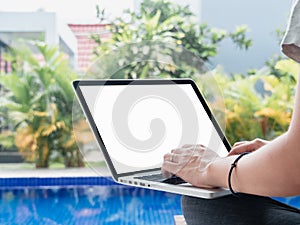 Young women working by the swimming pool. Female remote worker writing code, study, surfing internet during summer. Close up of ha