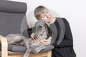 Young wonam with dog at home leisure. stayhome concept