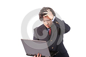Young woried business man working with laptop