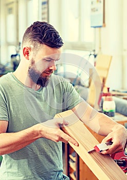 Young worker in a carpenters workshop